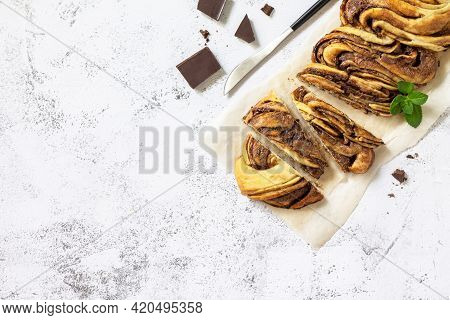 Fresh Pastries, Chocolate Day. Chocolate Babka Or Brioche Bread. Sweet Yeast Dough With Chocolate Fi