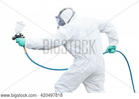 car painting. Worker with spraing gun