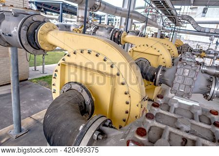 Pipes, Tubes, Machinery And Steam Turbine At A Power Plant