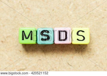Color Alphabet Letter Block In Word Msds (abbreviation Of Material Safety Data Sheet) On Wood Backgr