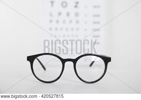 Glasses On Light Background, Closeup. Ophthalmologist Prescription