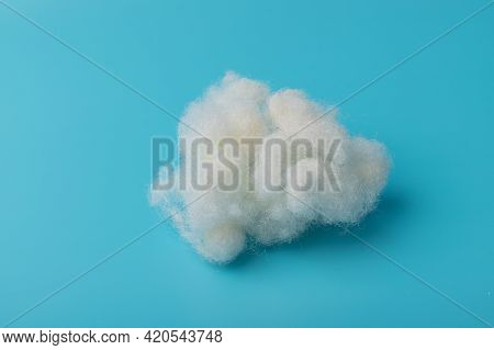 White Air Sintepon. Type Pillow Material. Sintepon Filler On Blue Background, Soft Texture