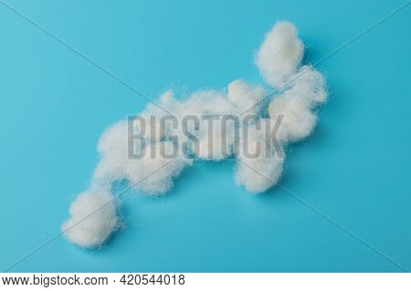 White Air Sintepon. Type Pillow Material. Sintepon Filler On Blue Background, Soft Texture