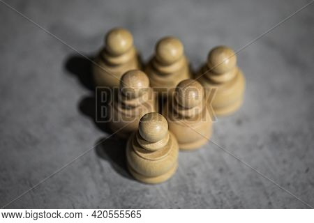 Triangle Made Up Of Tightly Shifted Chess Pieces Of Six Pawns. Teamwork, Close-knit Teams, Horizonta