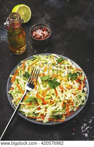 Coleslow Cabbage Salad With Carrot On Grey Kitchen Table. Top View, Copy Space