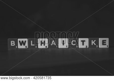 Brecht, Belgium - 28 July 2020: A Portrait Of Black And White Scrabble Letters, Which Are Mixed, But