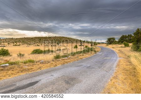 Sunrise Over Road In Highland Limestone Karst Plateau Landscape On Causse De Blandas, Occitanie, Fra