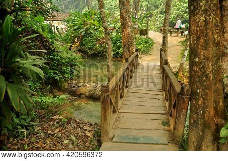 Small Wooden Bridge Crossing Stream Creek For Laotian People And Foreign Traveler Walking Travel Vis
