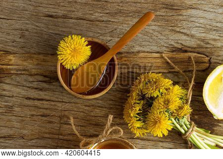 Homemade Delicious Dandelion Jam On A Wooden Table With Yellow Dandelions. Dandelion Flower Syrup. U