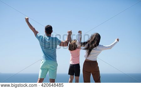 Summer Family. Back View Of Happy Young Family Walking On Beach. Child With Parents Holding Hands. F