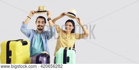 Happy Smiling Tourist Family Couple Or Friends Take Off Summer Hat Studio Shot