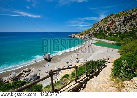 View of Preveli beach on Crete island with relaxing people and Mediterranean sea. Crete island, Greece