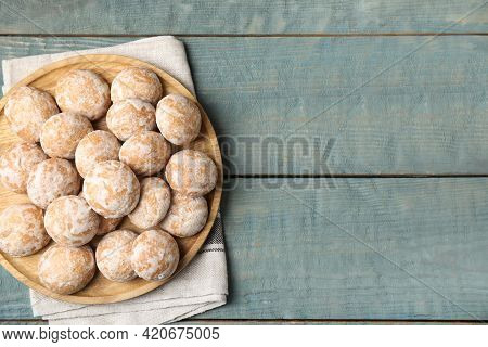 Plate With Tasty Homemade Gingerbread Cookies On Blue Wooden Table, Top View. Space For Text