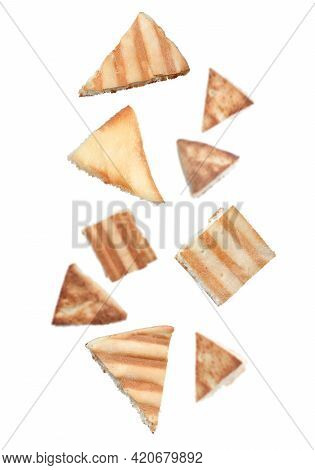 Delicious Crispy Pita Chips Falling On White Background
