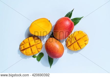 Mango Design Concept. Diced Fresh Mango Fruit On Blue Table Background.