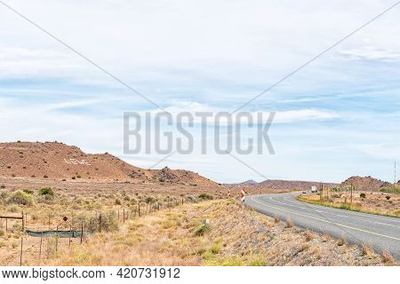 Vehicles Are Visible On Road N1 Between Richmond And Three Sisters In The Northern Cape Karoo. A Cro