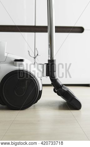 Bagless Cyclone Vacuum Cleaner On A Laminate. Electrical Apparatus That By Means Of Suction Collects