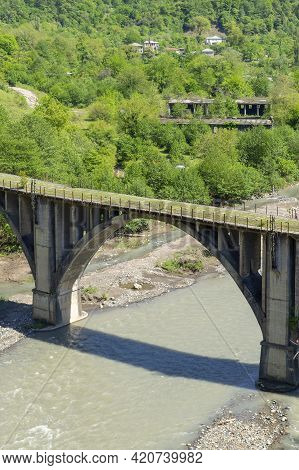 Abkhazia. Abandoned Railway Bridge Over The River Alxga. Attraction Of The Abandoned City Of Tkuarch