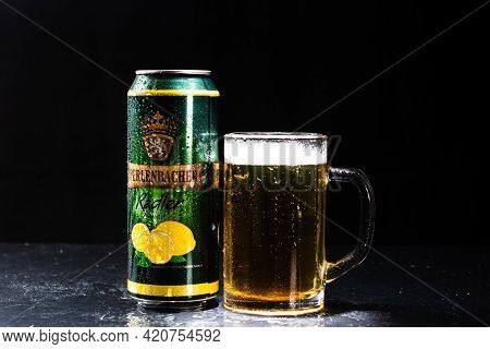 Can Of Perlenbacher Radler Beer And Beer Glass On Dark Background. Illustrative Editorial Photo Shot