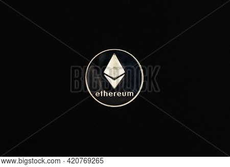 Ethereum Or Etherum Silver Coin On Black Background. Top View Of Eth Symbol.