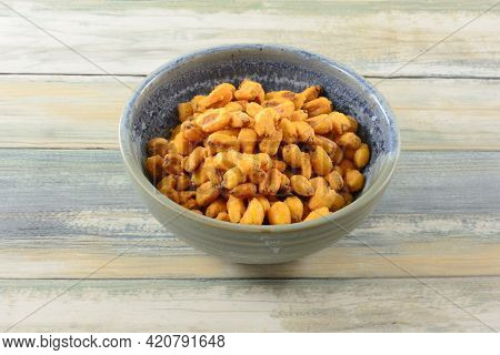 Turkish Roasted Paprika Corn Nuts In Ceramic Snack Bowl On Table