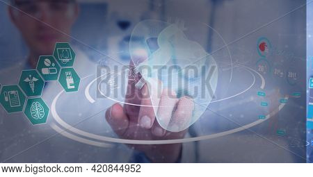 Medical data processing against male doctor wearing protective glasses touching invisible screen. medical research and technology concept