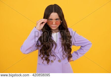 Keep Under Control. Serious Kid With Curly Hair In Sunglasses. Beauty And Fashion.