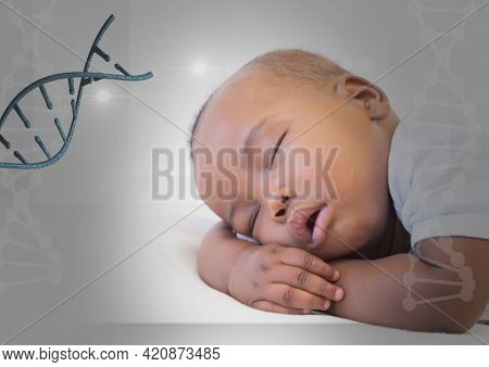 View of black baby sleeping against white background and dna animation around. digitally generated image.