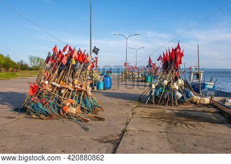 Krynica Morska, Poland - May 15, 2021: Fishing Red Flags In Port Of Krynica Morska Located On The Vi