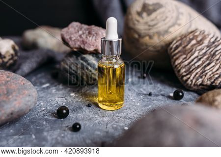 Small Glass Bottle With Natural Magic Oil. Cosmetic And Magic Elixir.
