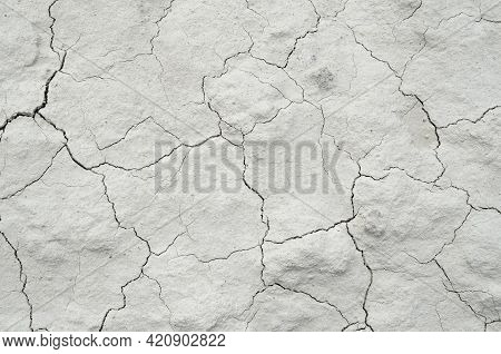 White Cracked Background Texture, Light Background With Dark Scratch, The Ground Near The Chalk Quar