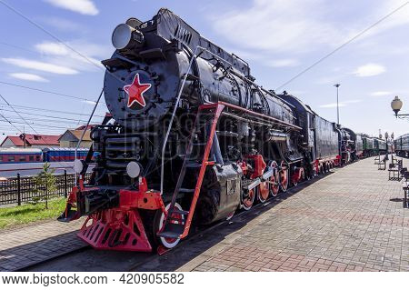 Black Retro Steam Locomotive With A Red Star. Museum Complex Of The History Of The Railway. Vintage 