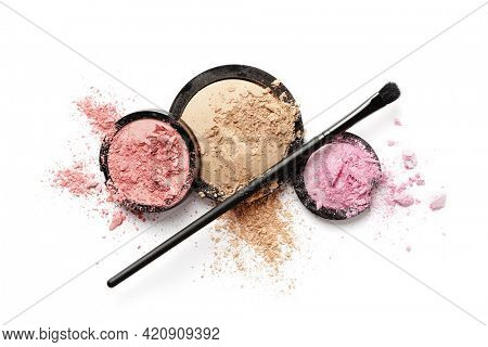 Colorful palette of eyeshadows and blushers. Professional makeup brushes and tools isolated on white background