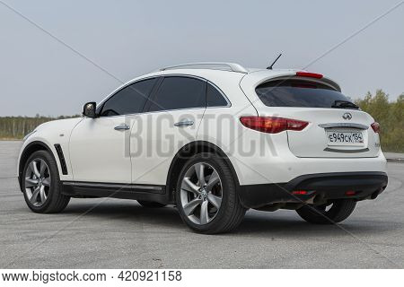 Novosibirsk, Russia - May 16, 2021: White  Infiniti Qx, Back View.  Photography Of A Modern Crossove