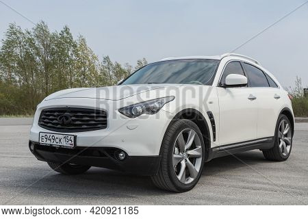 Novosibirsk, Russia - May 16, 2021: White  Infiniti Qx, Front View.  Photography Of A Modern Crossov