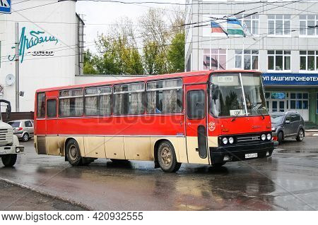 Ufa, Russia - September 26, 2008: Red Interurban Coach Bus Ikarus 256 In The City Street.