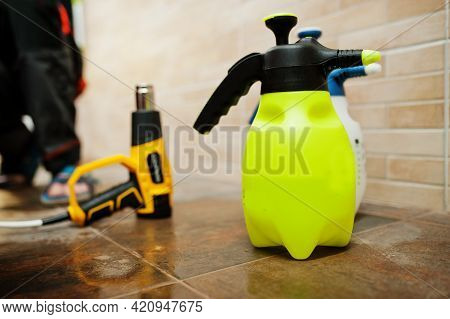 Spray Bottle At Car Service Detailing Vehicle Workshop. Car Protection With Special Films.