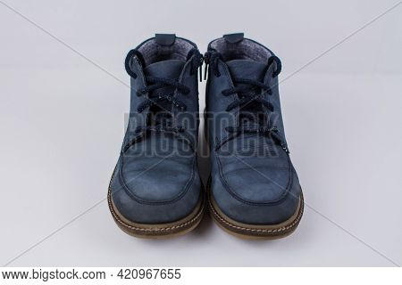 A Winter Blue Boots On A White Background