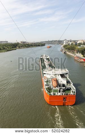 Multi-colored Ships Pass Under The Drawbridge