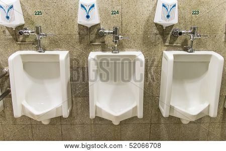 Urinals ,a Collection Of 3 Urinals In A Men's Bathroom