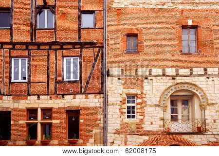 Facades of brick medieval houses in town of Albi in south France