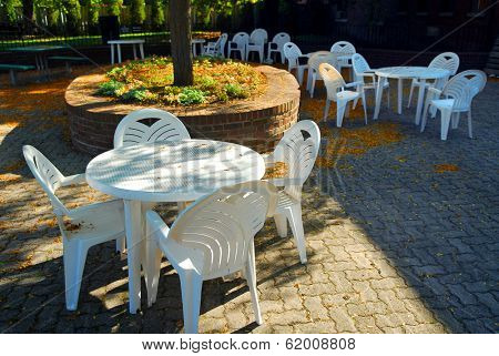 Empty tables of outdoor cafe in the fall