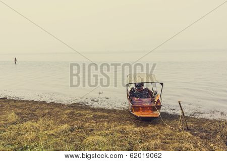 A Boat At River Bank