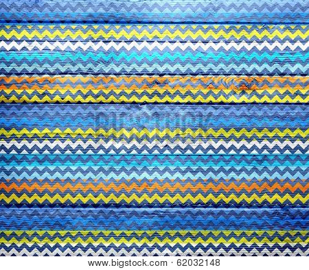Seamless colored chevron pattern on wood texture