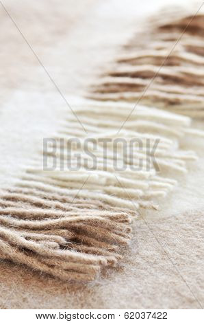 Soft and warm folded alpaca wool blanket with fringe