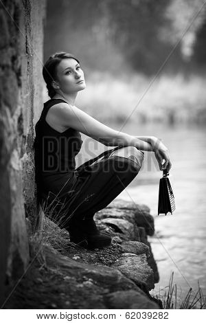 Beautiful Woman Holding Cluch Bag And Dreaming
