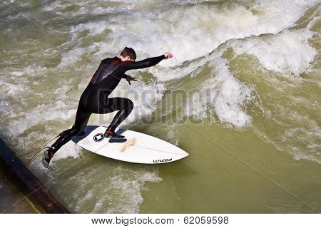 Surfer Surfs At The Isar In Huge Waves