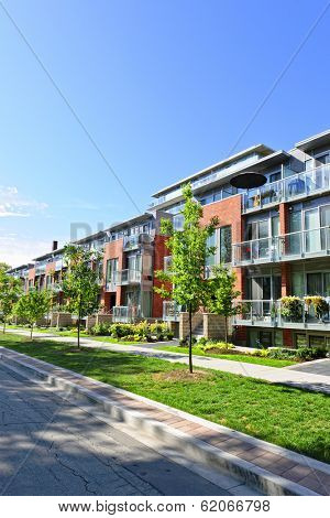 Modern town houses of brick and glass on urban street