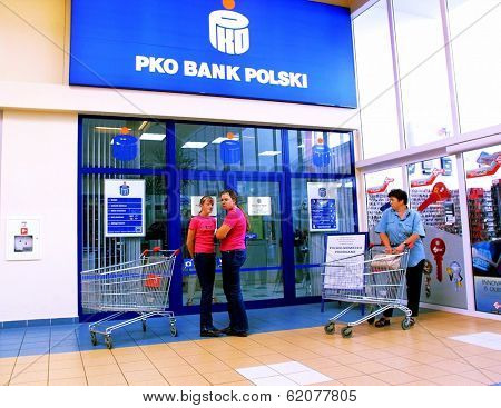 KRAKOW, POLAND, 25 OCTOBER 2003 -- A customer withdraws money from a Bank PKO BP automated teller cash machine. Bank PKO is one of Poland's leading financial institutions.
