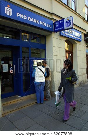 KRAKOW, POLAND, 25 OCTOBER 2003 -- A customer withdraws money from a Bank PKO BP automated teller cash machine. Bank PKO is one of Poland's leading financial institutions.